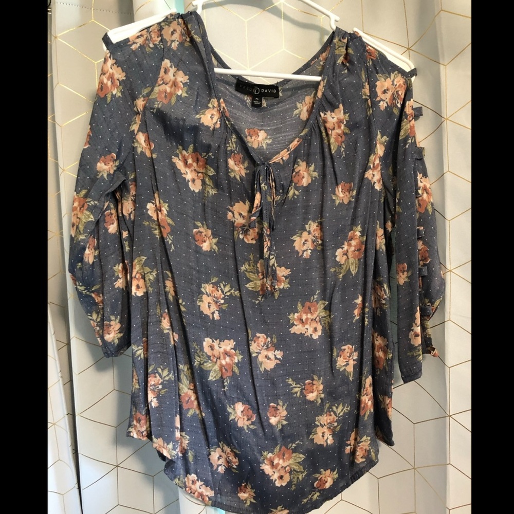 Flower blouse with arm cutout details.